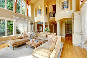 Beautiful family room with a full 2 story wall of windows.